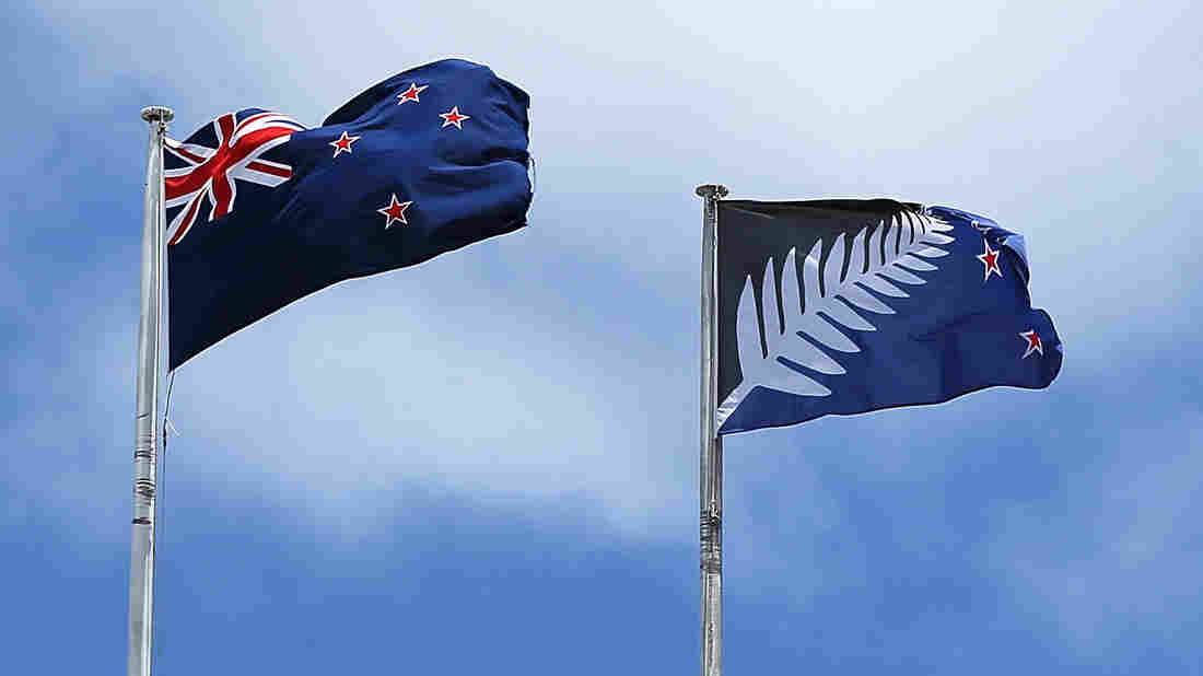A photo from December shows the current New Zealand flag (left) and the alternative design currently up for a vote.  Fiona Goodall/Getty Images News